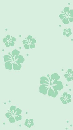 a light green wallpaper with flowers on it