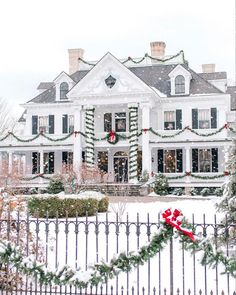 a large white house covered in christmas decorations