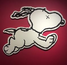 a sticker depicting a dog laying on its back with a cross in the middle