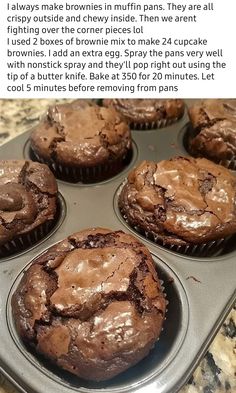 some chocolate muffins are sitting in a cupcake pan