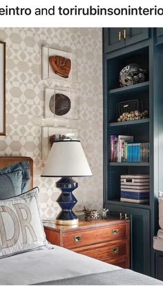 a bed room with a neatly made bed next to a book shelf filled with books