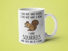 a red and white coffee mug with a squirrel saying i do not have ducks, i do not have a row