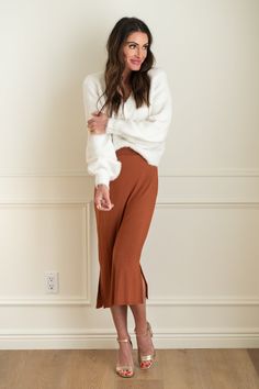 Chic Pencil Skirt For Loungewear, Chic Knit Skirt For Loungewear, Knit Skirt For Spring Loungewear, Chic Lined Skirt For Loungewear, Chic Loungewear Skirt With Elastic Waistband, Chic Skirt With Elastic Waistband For Loungewear, Chic Knit Midi Skirt, Casual Knee-length Bottoms With Side Slits, Chic Knit Midi Bottoms