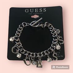 Brand New Guess Logo Silver Charm Bracelet Toggle Clasp Crystal And Letter Charms Length Is 7”, But W/Clasp It’s 7.5” Comes Boxed Ready For Gifting! Free Gift W/Purchase! Bundle 2 Or More Listings For Additional 10% Off All Reasonable Offers Are Welcome. I Can’t Say Yes If You Don’t Ask! Thanks For Looking Through My Happy Poshing! Silver Aesthetic Jewelry, 2010 Jewelry, Xoxo Jewelry, Jewelry Closet, Handmade Charm Bracelets, Dope Jewelry Accessories, Charm Bracelet Silver, Guess Jewelry, Charms For Bracelets