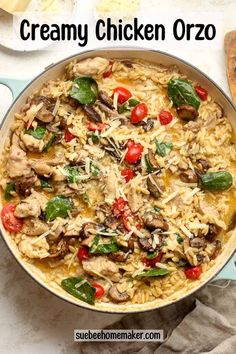 creamy chicken orzo with spinach and tomatoes in a skillet