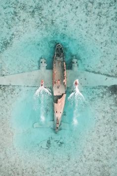 an aerial view of a boat in the water