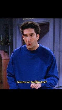 a man in a blue sweater is talking to someone on the television show, simon or guttnikel?