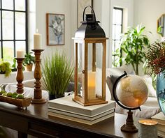 a lantern sitting on top of a wooden table