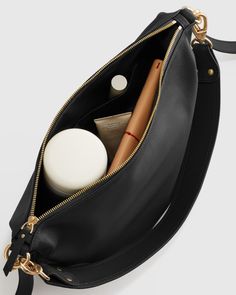 Buttery soft, perfectly slouchy and entirely timeless, our Italian Leather Convertible Crescent Shoulder Bag is the perfect style to add into your rotation. And the goes-with-anything piece (crafted from 100% Italian leather) features two detachable straps, allowing you to mix it up by wearing atop your shoulder or as a chic crossbody.  | Quince | Women's Italian Leather Convertible Crescent Shoulder Bag in Black Black Leather Purses And Bags, Timeless Shoulder Bags, Everyday Baguette Bag With Removable Pouch, Versatile Soft Leather Baguette Bag For Errands, Pouch Baguette Bag With Detachable Handle For Everyday Use, Detachable Handle Pouch Hobo Bag For Everyday, Everyday Pouch Baguette Bag With Detachable Strap, Daily Crossbody Hobo Bag With Removable Pouch, Versatile Everyday Hobo Bag With Detachable Handle