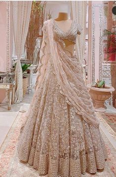 a wedding dress on display in a room