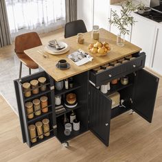 a kitchen island with spice racks on the top and drawers underneath it, in front of a dining room table