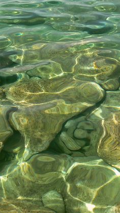 the water is crystal green and clear with little ripples on it's surface