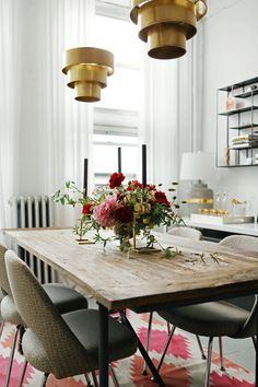 a dining room table with flowers on it