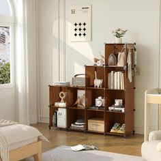 a living room filled with furniture next to a window