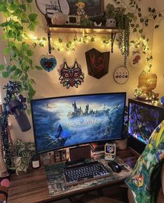 a desktop computer sitting on top of a wooden desk in front of a wall covered with plants