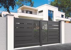 an image of a modern gate in front of a house