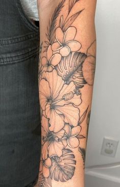 a woman's arm with flowers on it