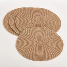 three round placemats on a white background