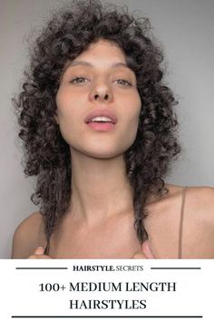 An extra curly version of the shag haircut will ensure that your face is surrounded by beautiful, bouncy curls. This is a great medium length hairstyle option, so you don’t miss the long hair days! #mediumhairstyles #curlyhair #shaghaircut #curlyhairstyle #hairstylesecrets The Shag Haircut, Heavy Bangs, Medium Length Hairstyle