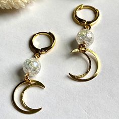 Adorn your ears with these unique and feminine Crescent Moon Dangle Earrings. Handcrafted with a 18k gold filled huggie hoops for a lightweight lasting style, these dainty pieces of jewelry are perfect for adding a stylish and cute touch to any outfit. Hypoallergenic and distinct, these earrings will elegantly complete any look. ☆Lead and Nickel Free☆Lightweight ☆Gold Filled ☆Quartz Crystal Crescent Jewelry, Beads Bracelet Design, Bracelet Design, Beads Bracelet, Crescent Moon, Bracelet Designs, Crescent, Quartz Crystal, Gold Filled