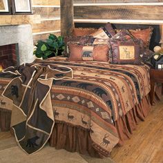 a bed in a bedroom next to a fire place with a blanket and pillows on it