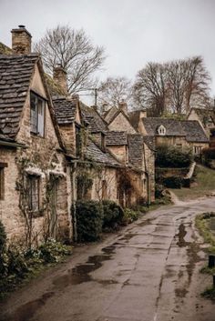 an old cobblestone street lined with stone houses