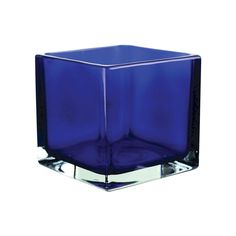 a square blue glass vase sitting on top of a white surface with chrome rims