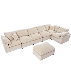 a large sectional couch with ottoman and footstool in beige fabric, on an isolated white background