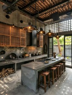 an industrial style kitchen with concrete counter tops and stools