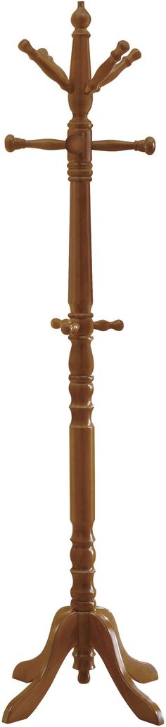 a wooden table with four legs and three arms on it's base, in the shape of a cross