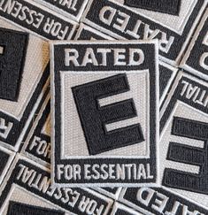 several black and white patches with the word e on them