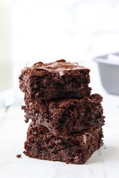 three chocolate brownies stacked on top of each other