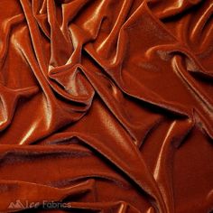 a close up view of a shiny red fabric