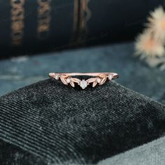 a close up of a ring on top of a book