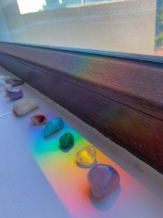 several rocks are sitting on the window sill