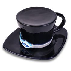 a black cup and saucer on a white background