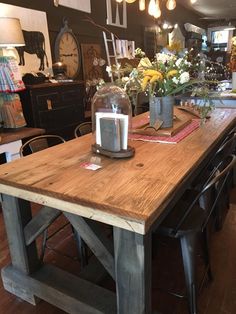 a wooden table sitting inside of a store