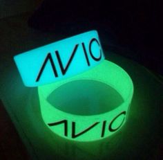 glow in the dark wristbands that say avio and avic on them