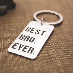 a keychain with the words best bro ever on it