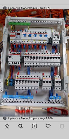 an electrical panel is shown with many different types of wires and sockets in the box