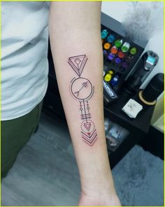 a woman's arm with a tattoo on it and a clock in the middle