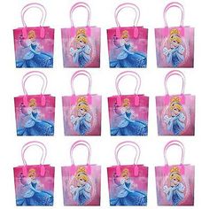 disney princess party bags are shown in pink and blue colors, each with an image of the