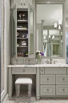 a bathroom with two sinks and a large mirror