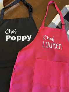 two aprons that say chef, chef lauren and chef poppy on the front one is black with white letters