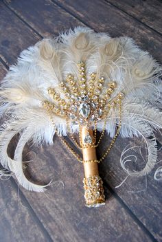 "18\" Big silver Bridal Fan brooch Bouquet Ostrich Big alternative Feather Fan Bridal Ivory Great Gatsby 1902s art deco wedding bouquet I have the brooches in gold , rose gold and silver - if you wish me to use different brooch color just let me know. Silver Glamour Brooch Bridal alternative Ostrich Feather Fan Bridal Bouquet Ivory Champagne Great Gatsby 1902s Bouquet Bouquet and matching boutonniere The gorgeous vintage inspired feather fan can be a great alternative feather bouquet ! A Great a Bridal Bouquet Ivory, Bridal Fan, Gatsby Party Decorations, Unique Wedding Bouquet, Feather Bouquet, Simple Wedding Bouquets, Bridal Brooch, Crystal Bouquet, Bridal Brooch Bouquet