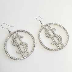 For my ladies who love that hip-hop vibe, these stunner Dollar Sign Rhinestone Earrings are for you.  In-layed Rhinestones surround a dollar sign inside a hoop. These earrings are bold, big and daring. For the girl who knows her worth.  Features: >Zinc Alloy >Rhinestones >Drop Earrings >Lightweight >Size: 2.4 inches long Sign up for the Pretty Fab Things Reward Program or Newsletter and we will send you a coupon code good for 10% off Coupon! Copy and paste the link below into your browser and on Baddie Hoop Earrings, Baddie Earrings, Rhinestone Hoop Earrings, Edgy Earrings, Rhinestone Fashion, Dollar Sign, Tiny Studs, Kids Earrings, Animal Earrings