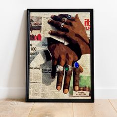 two hands are holding each other with their fingertipss on top of the newspaper pages