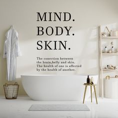 a bathroom with a bathtub and shelves on the wall that says mind, body, skin