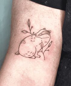 a small tattoo on the leg of a person