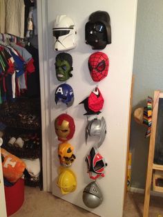 there are many helmets hanging on the wall